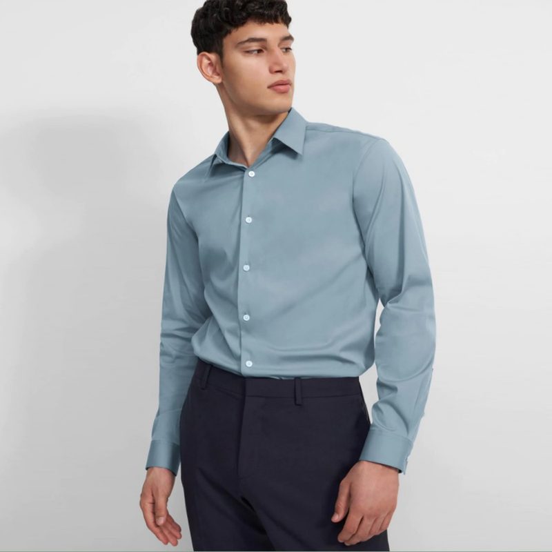 A man wearing a blue Sylvain shirt.