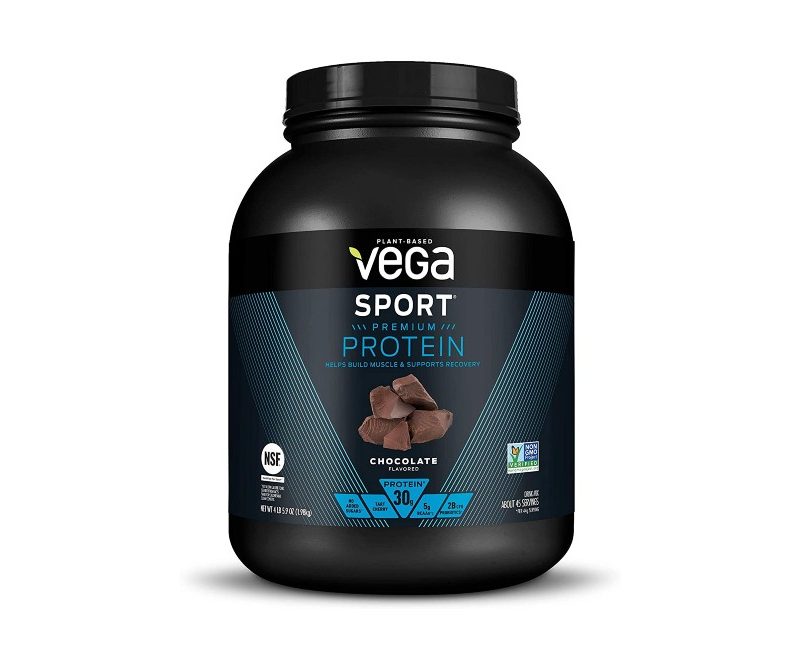 Vega sport chocolate protein powder on white background.