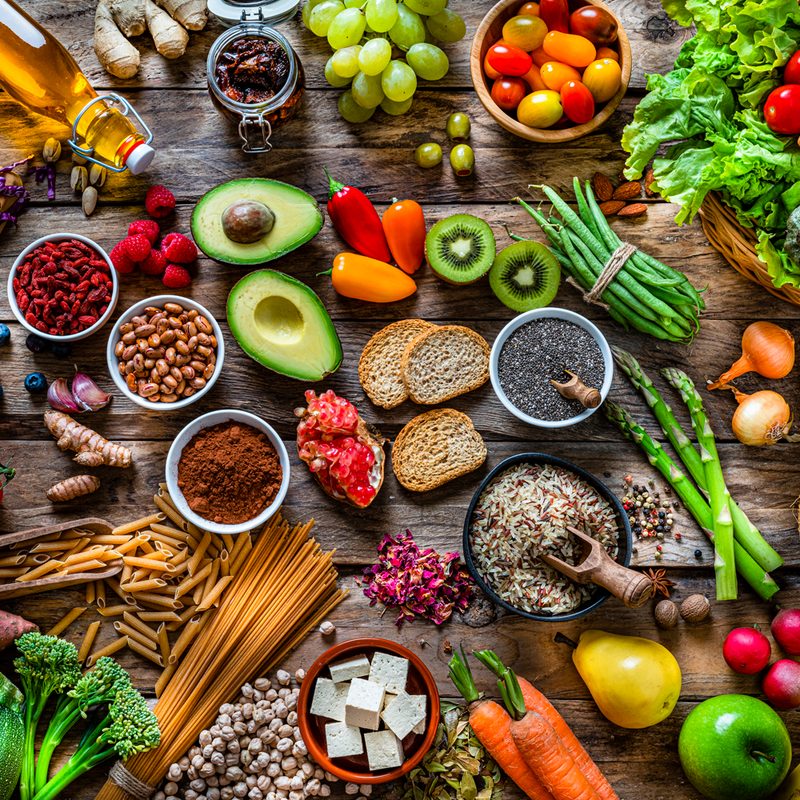 A bird's-eye view of healthy foods on a table.