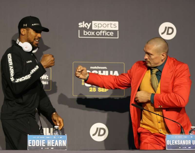 Anthony Joshua and Oleksandr Usyk presser with two opponents meeting face to face.