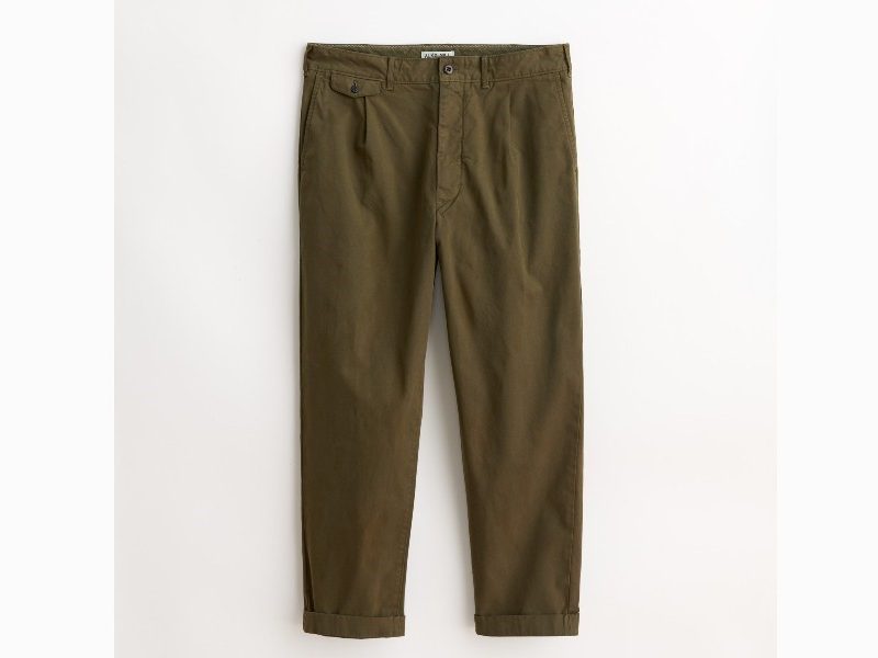 Standard Pleated Pant in Military Olive by Alex Mill on gray and white background.