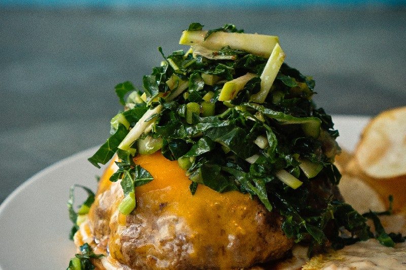 Burger with apple kale slaw.