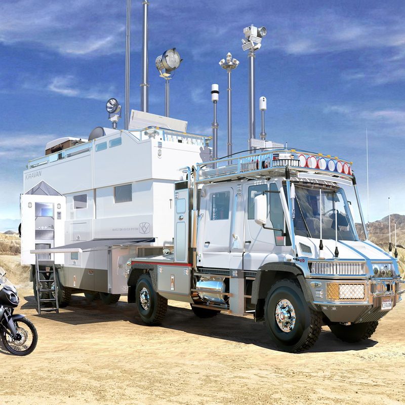 Rider on a motorcycle beside the Applied Minds KiraVan Expedition Systems overlanding vehicle.