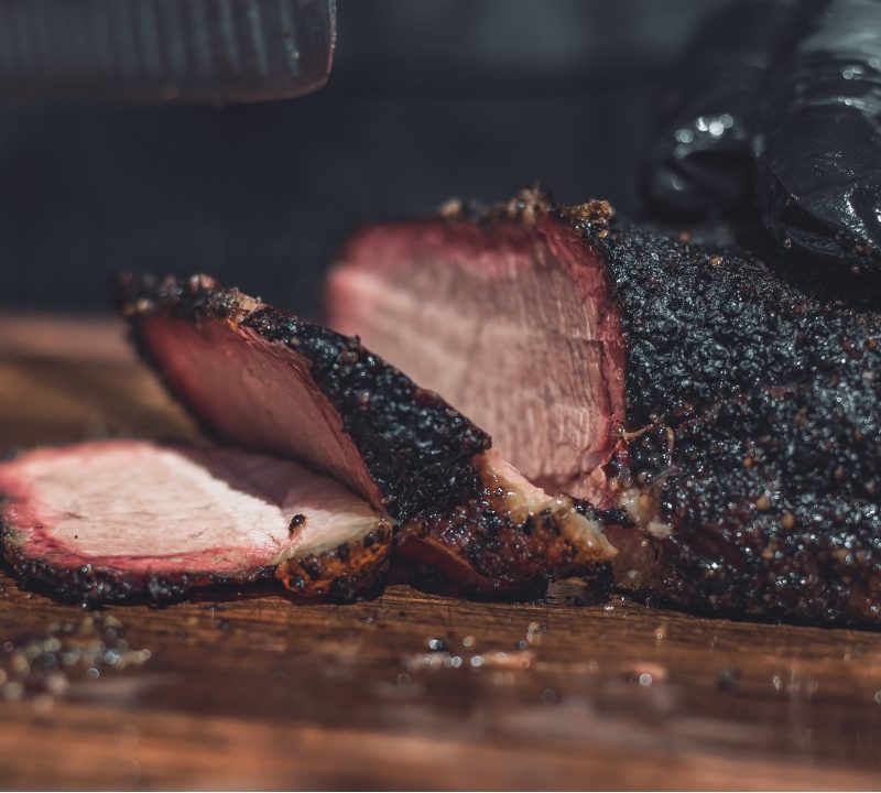 BBQ Brisket being sliced by hand.