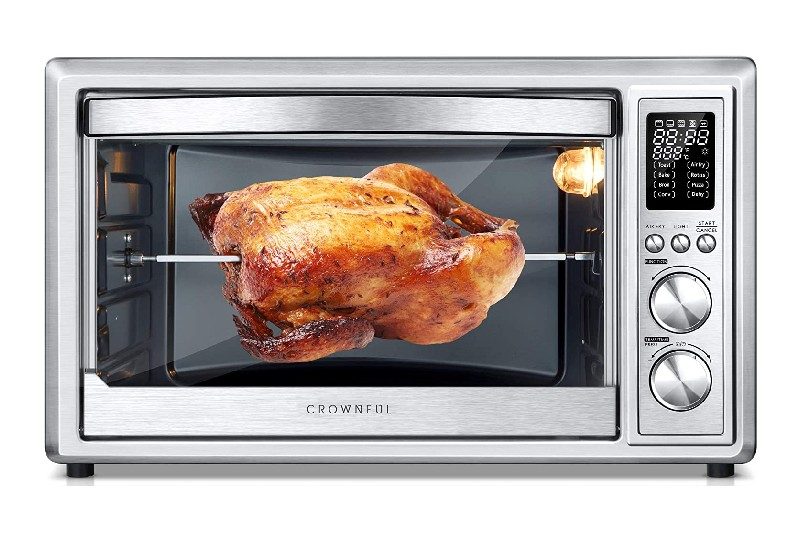 Rotisserie chicken inside an oven air fryer.