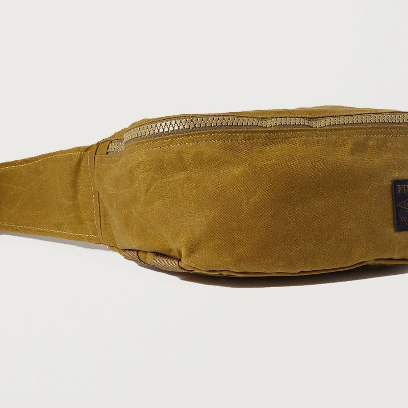 A brown Filson Tin Cloth Belt Bag.