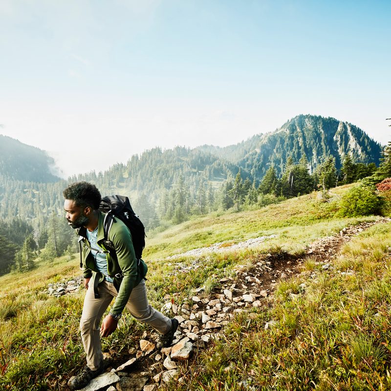 A man going on an early-morning hike in the mountain.