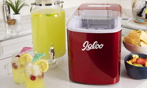 Igloo ICEB26RR Portable Countertop Ice Maker in red with food and drink.