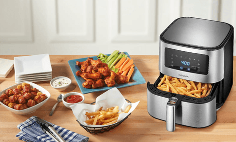 Air fryer with food around it.