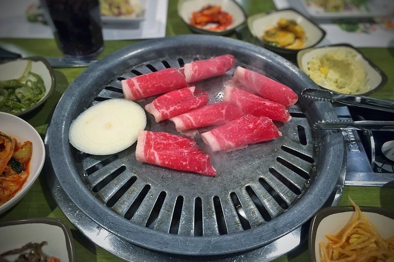 Korean style thin brisket grilled Korean BBQ style table-side..