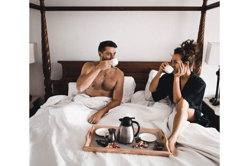 A couple having breakfast in bed.