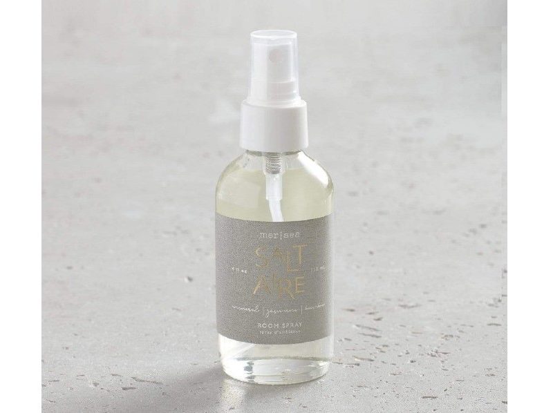 Mersea Saltaire Spray Room in a bottle on a gray background.