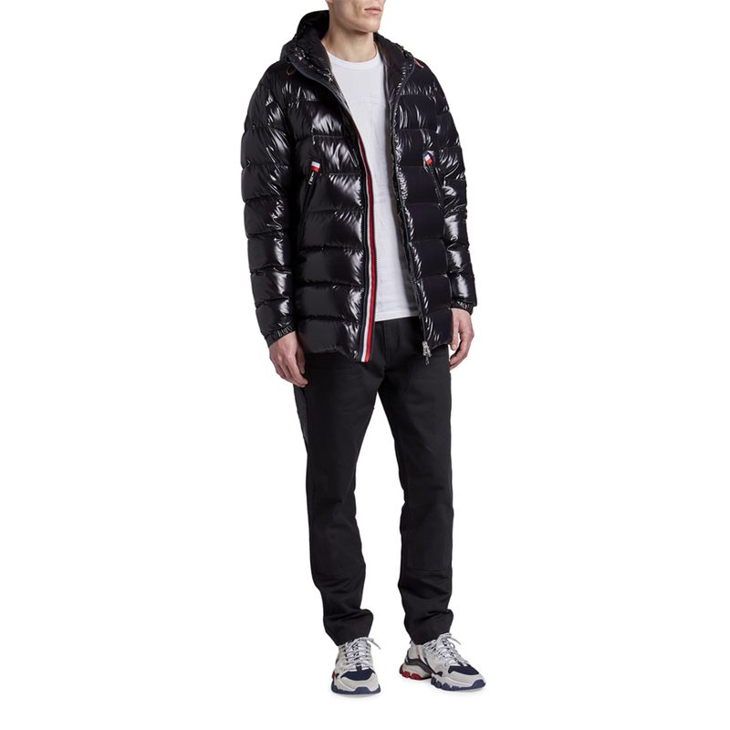 A male model wearing a Moncler Courcillon Hooded Puffer Jacket.