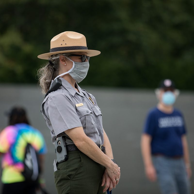 A National Park Service employee ranger wears a mask while patrolling the Tidal Basin during the March on Washington protest.