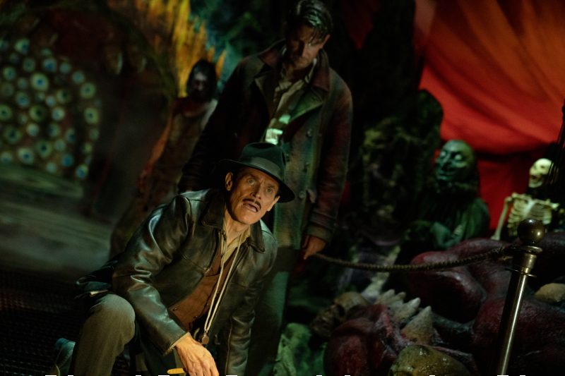 Bradley Cooper creeps up behind Willem Dafoe &mdash; just two of the star-studded cast in Guillermo del Toro's "Nightmare Alley."