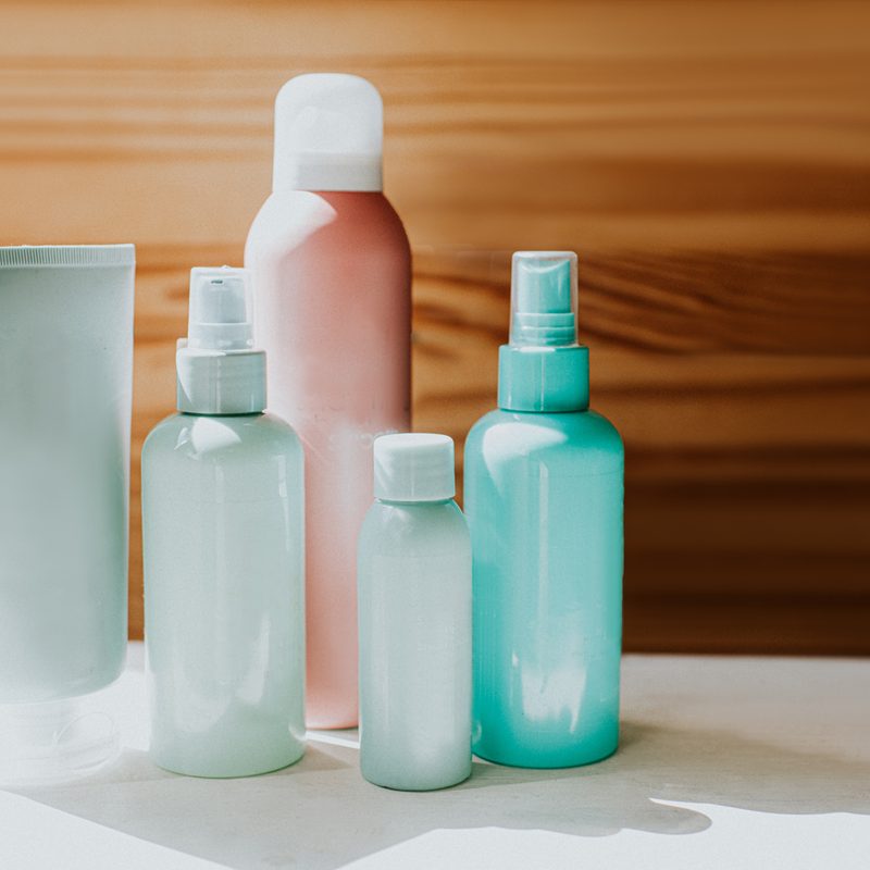 Assorted bottles of toiletries in a bathroom.