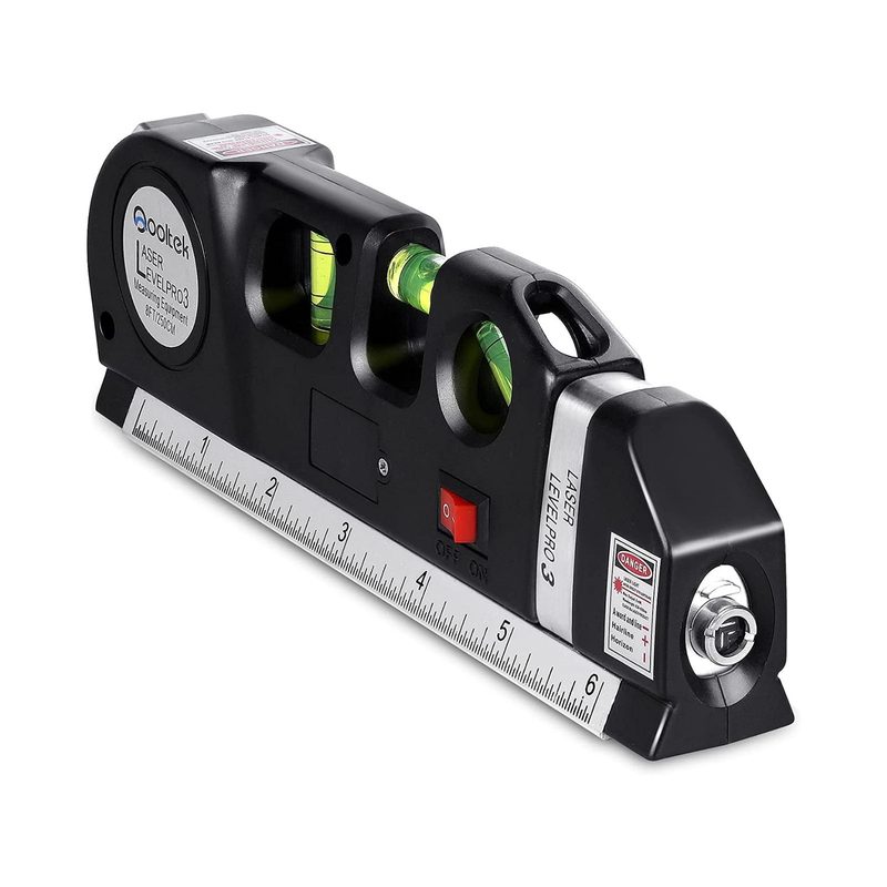 A black laser level used to measure distance and hang pictures.