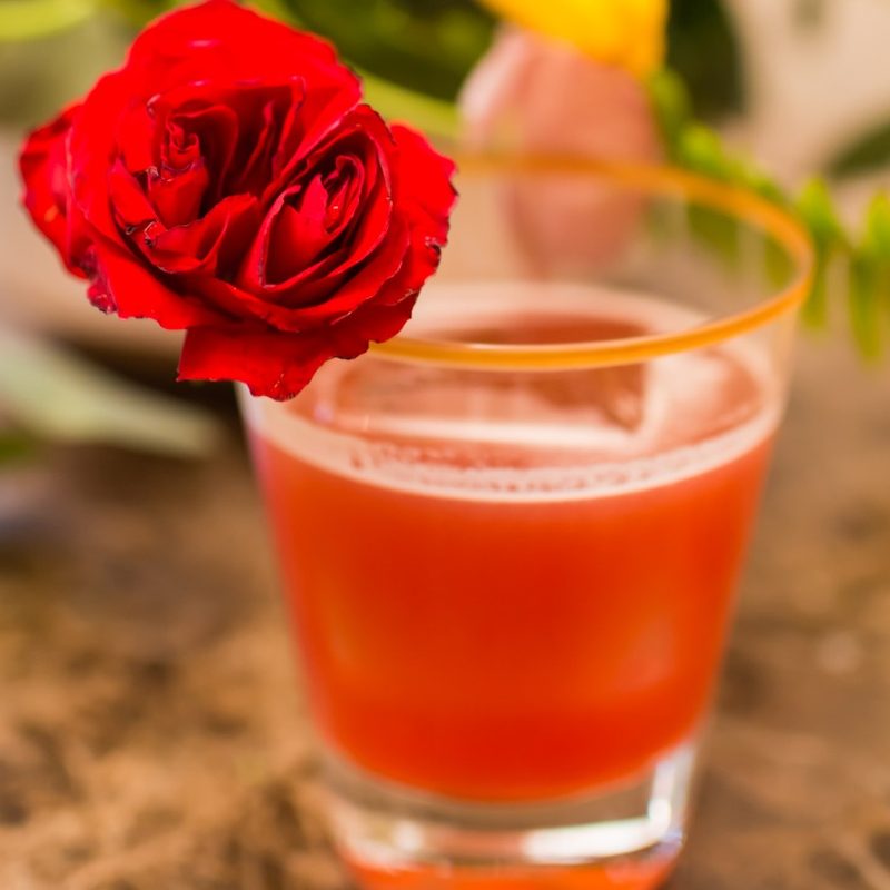 Roses & Pistols cocktail with flower garnish
