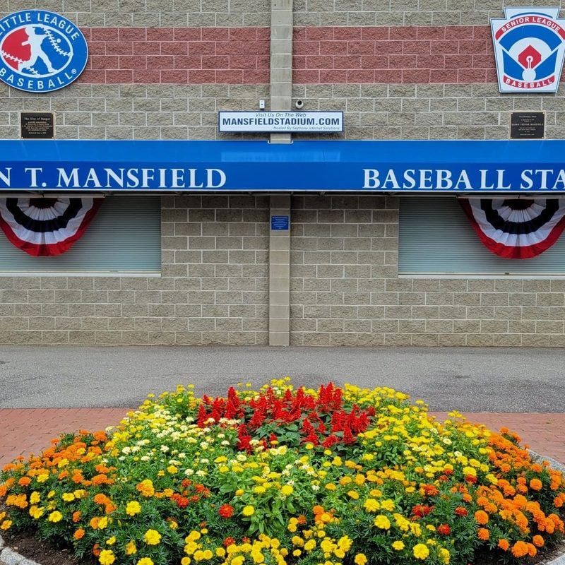 Shawn T Mansfield Stadium with a circular flowerbed at the entrance.