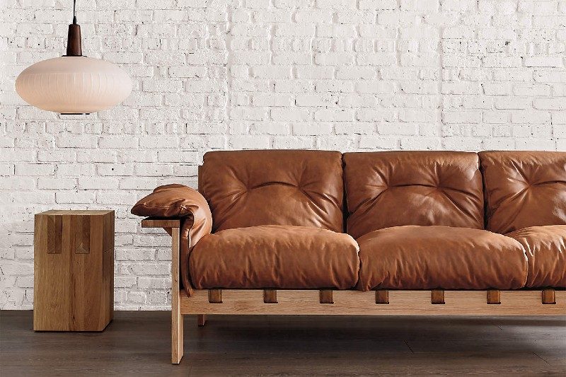 Shinola Oak End Tables with a white lamp and a square chair.