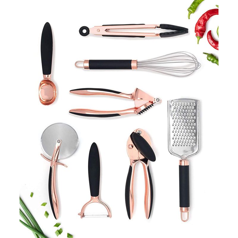 Kitchen utensils with chili and vegetable stalks at the top right and lower left corners, respectively.