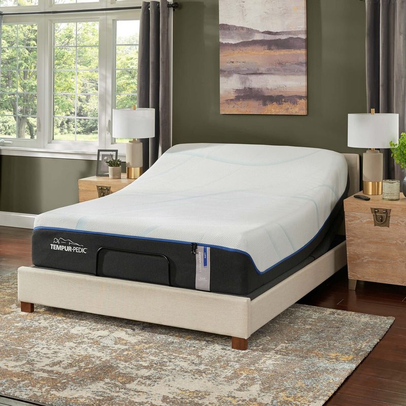 A Tempur-LuxeAdapt on a bed frame in a bedroom.