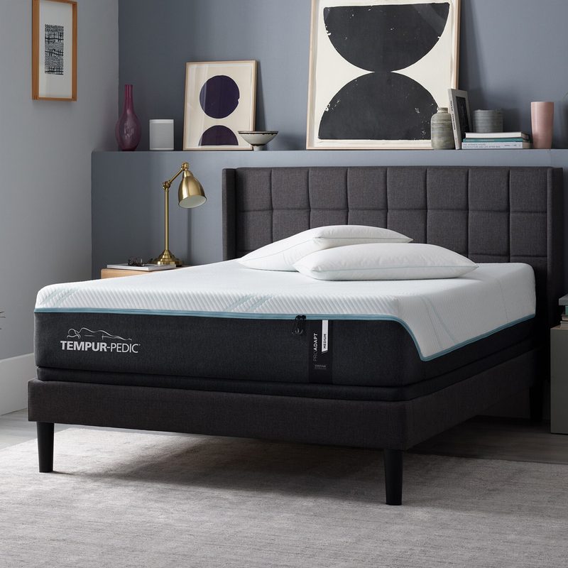 A Tempur-ProAdapt on a gray bed frame in a bedroom.
