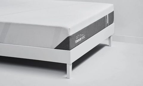 Tempur-Cloud mattress on a white bed frame.