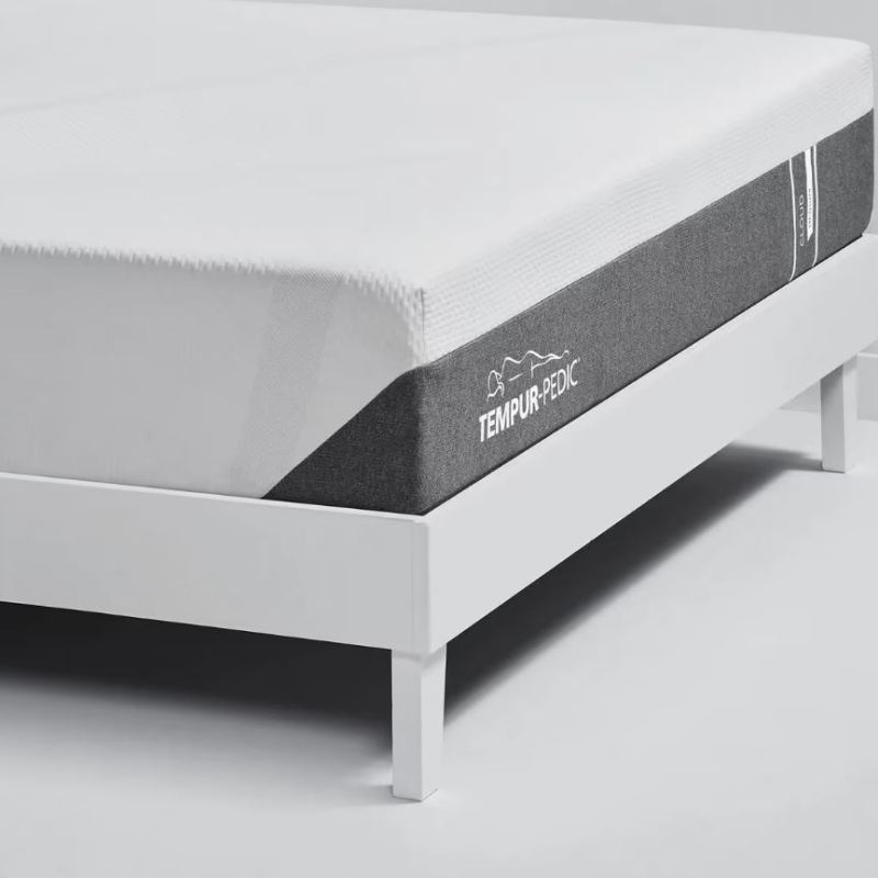 Tempur-Cloud mattress on a white bed frame.
