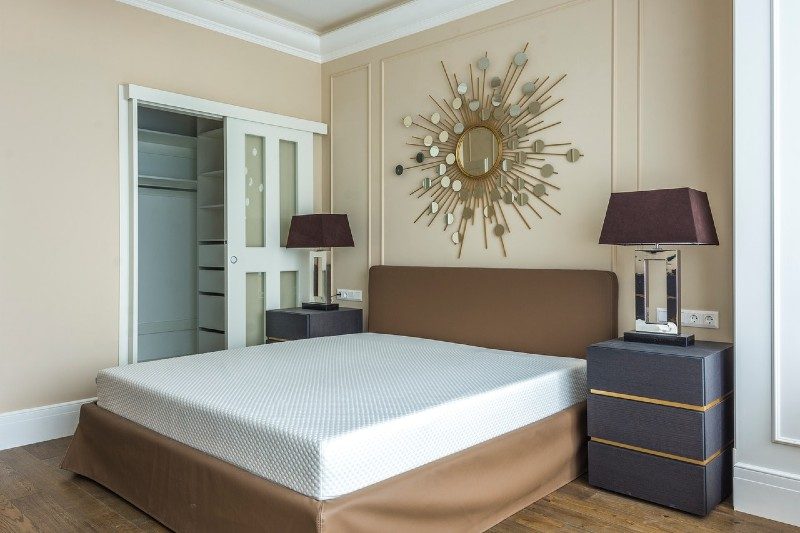 thick mattress with no blankets on a bed