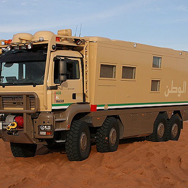A Unicat Terracross overlanding vehicle parked in the desert.