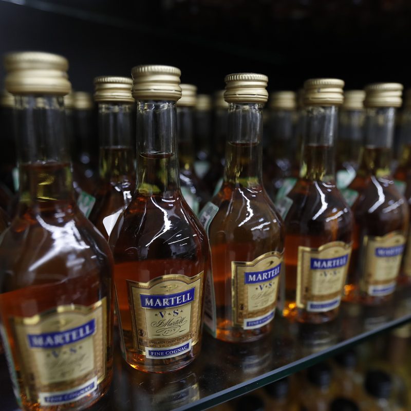 Bottles of Martell VS Cognac in a supermarket.