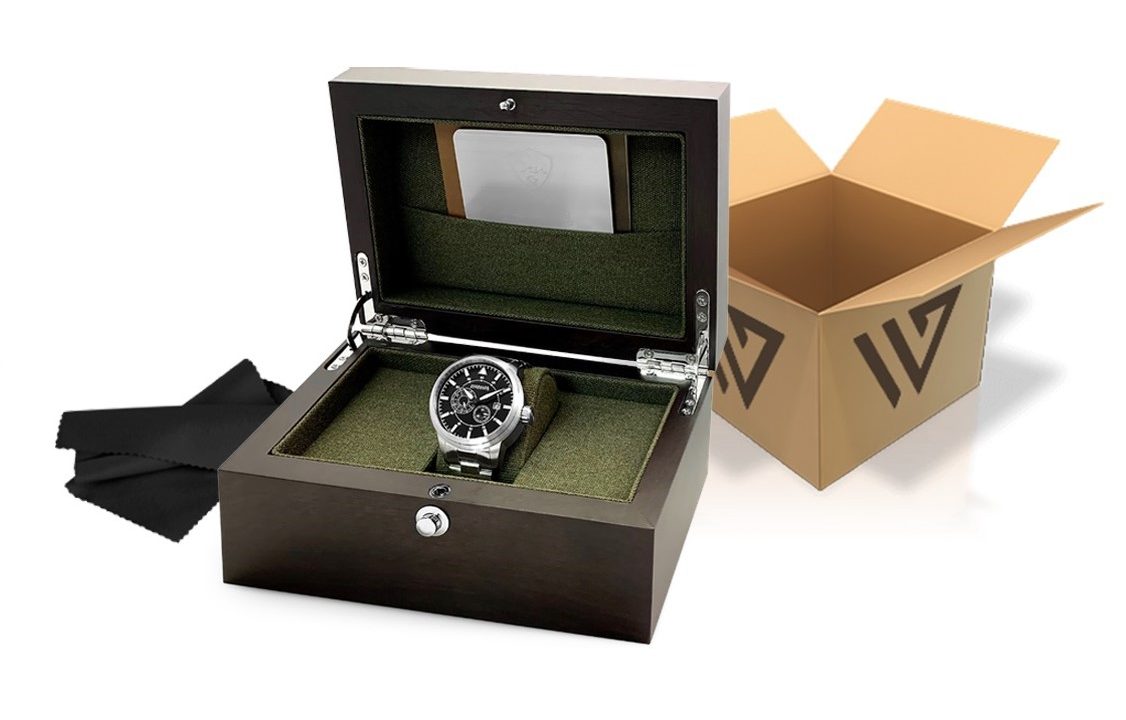 A silver watch in a wooden box