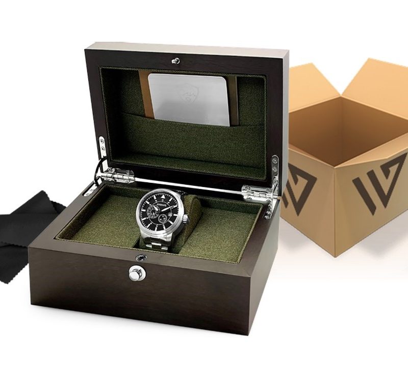 A silver watch in a wooden box