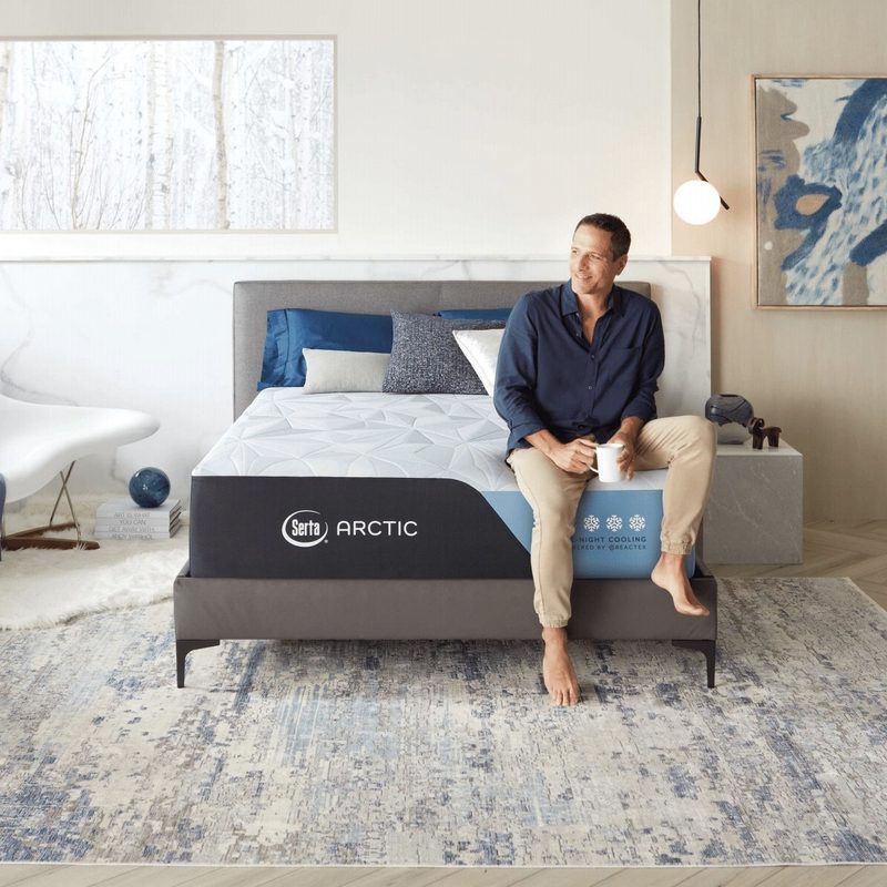 Arctic Premier mattress with man sitting on top.