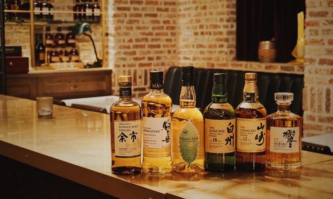 Array of Japanese whisky bottles on a counter
