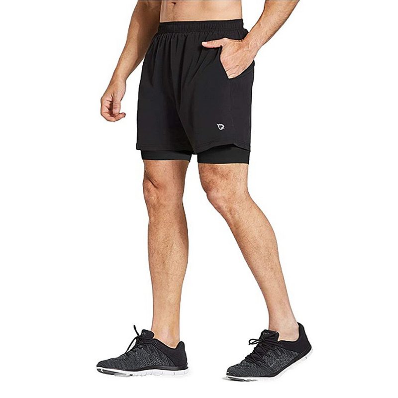 A midsection of a male model wearing a black running shorts from Baleaf.