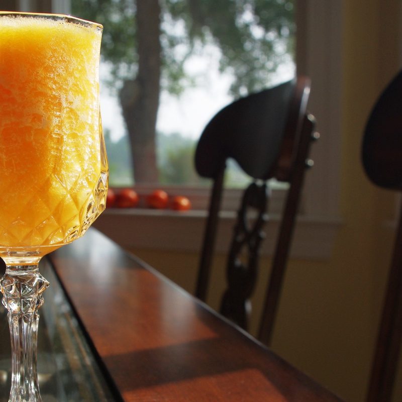 Bellini cocktail on table.