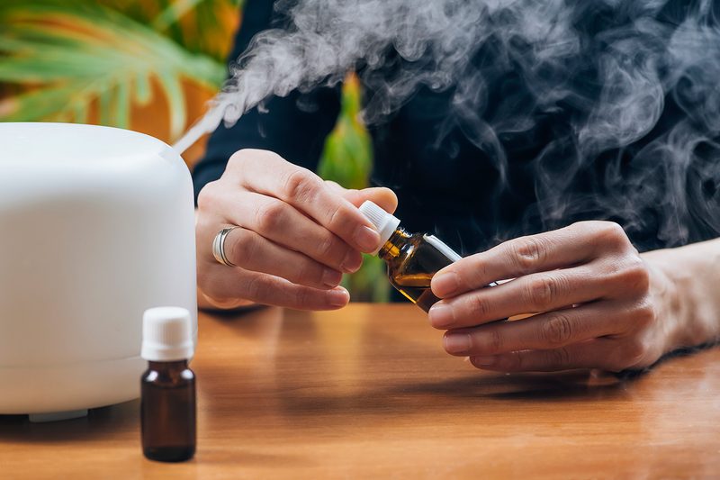 Adding natural aromatic essential oil Into air humidifier