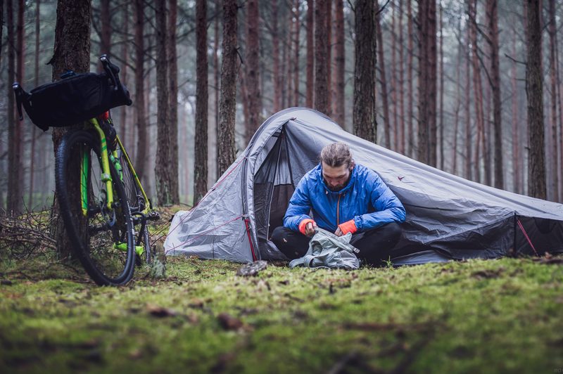 Camper sitting outside his tent