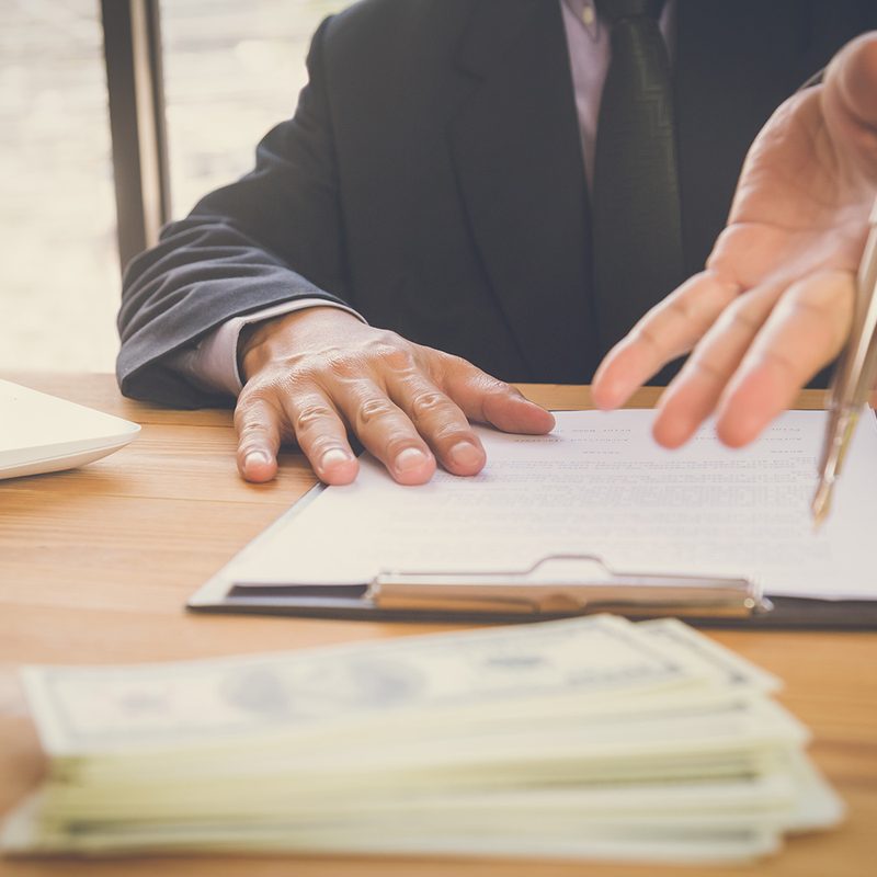 Business man signing contracts.