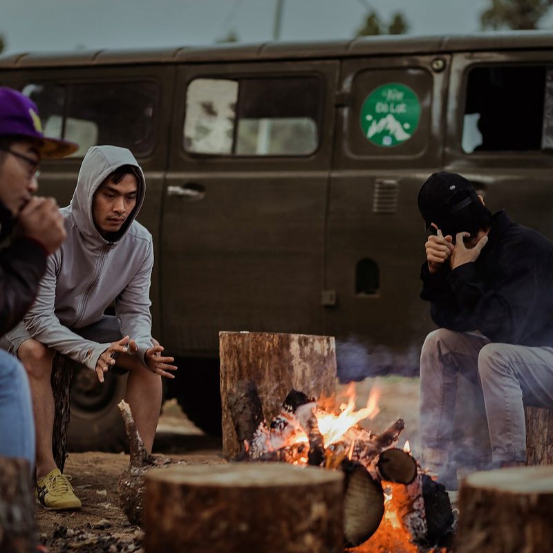 camping in the fall around campfire.