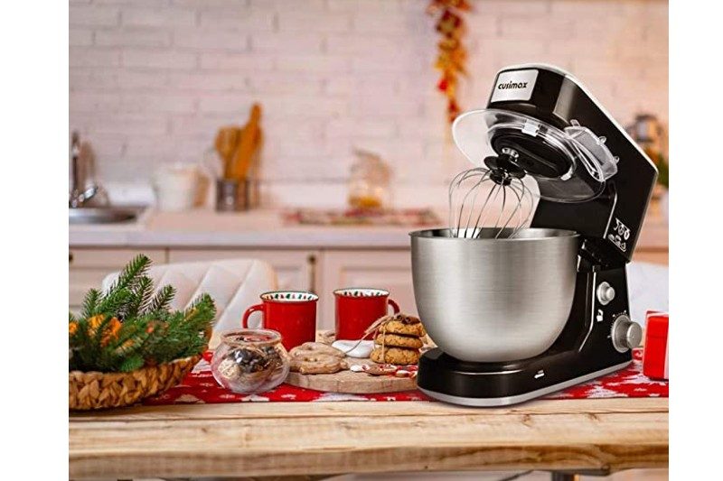 cuisimax stand mixer sitting on a counter next to food.