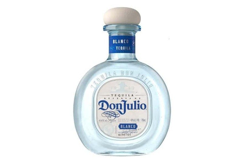 Bottle of Don Julio blanco tequila with a white background.