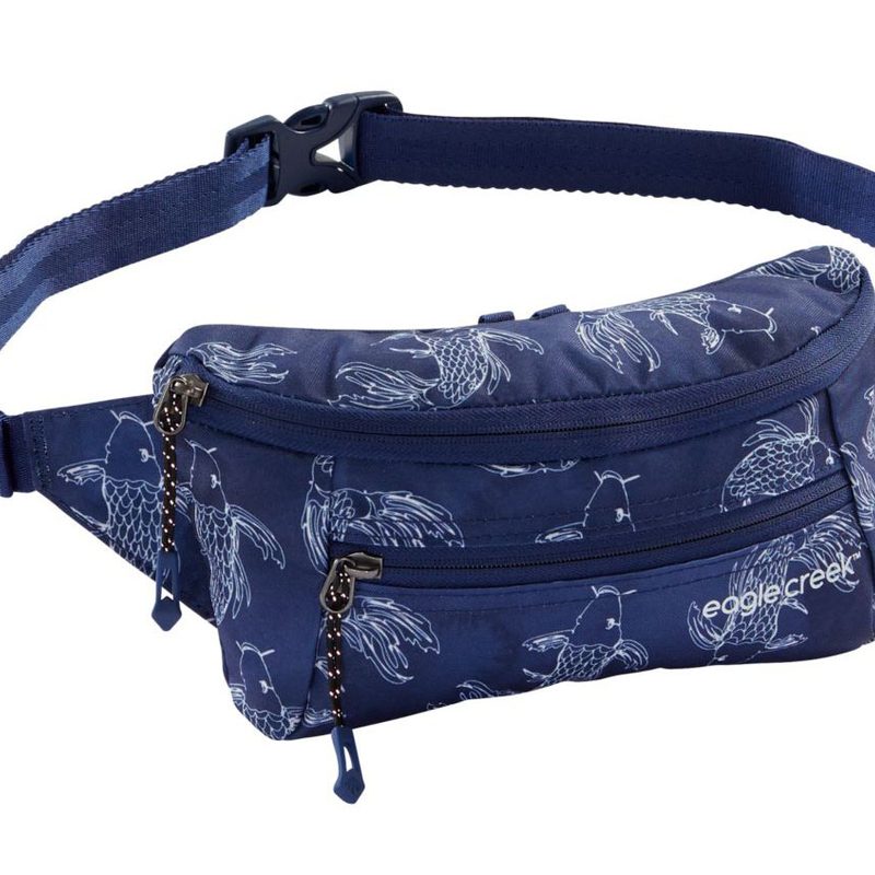 This Eagle Creek cross body bag features a koi pattern on an inky blue background.
