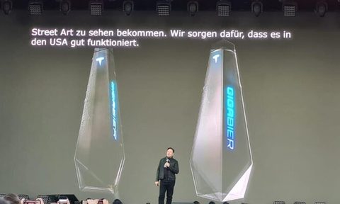 Elon Musk introducing Tesla's new 'Giga Bier' at the Oct. 9 Giga Fest at the Gigafactory at the Berlin-Brandenburg County Fair.