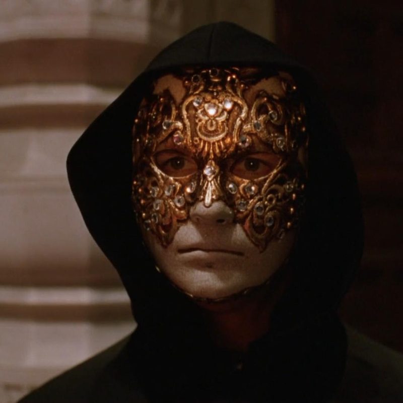 Scene featuring the iconic mask worn in the 1999 movie Eyes Wide Shut.