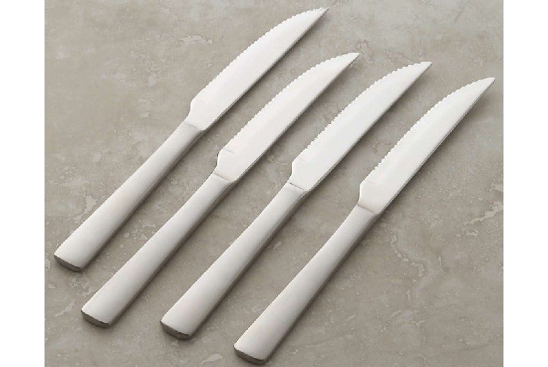 Four Foster steak knives.