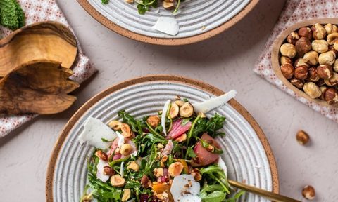 Hazelnut Arugula Salad on table.