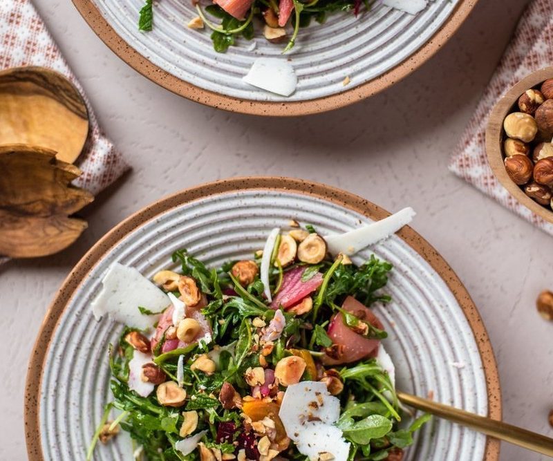 Hazelnut Arugula Salad on table.